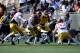 Apr 19, 2014; Los Angeles, CA, USA; Southern California wide receiver Victor Blackwell (center) runs the ball after a catch defended by Southern California inside linebacker Joel Foy (51) and safety Matt Lopes (37) during the Southern California Spring Game at Los Angeles Memorial Coliseum. Mandatory Credit: Kelvin Kuo-USA TODAY Sports