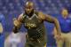 Virginia offensive lineman Morgan Moses runs a drill at the NFL football scouting combine in Indianapolis, Saturday, Feb. 22, 2014. (AP Photo/Michael Conroy)