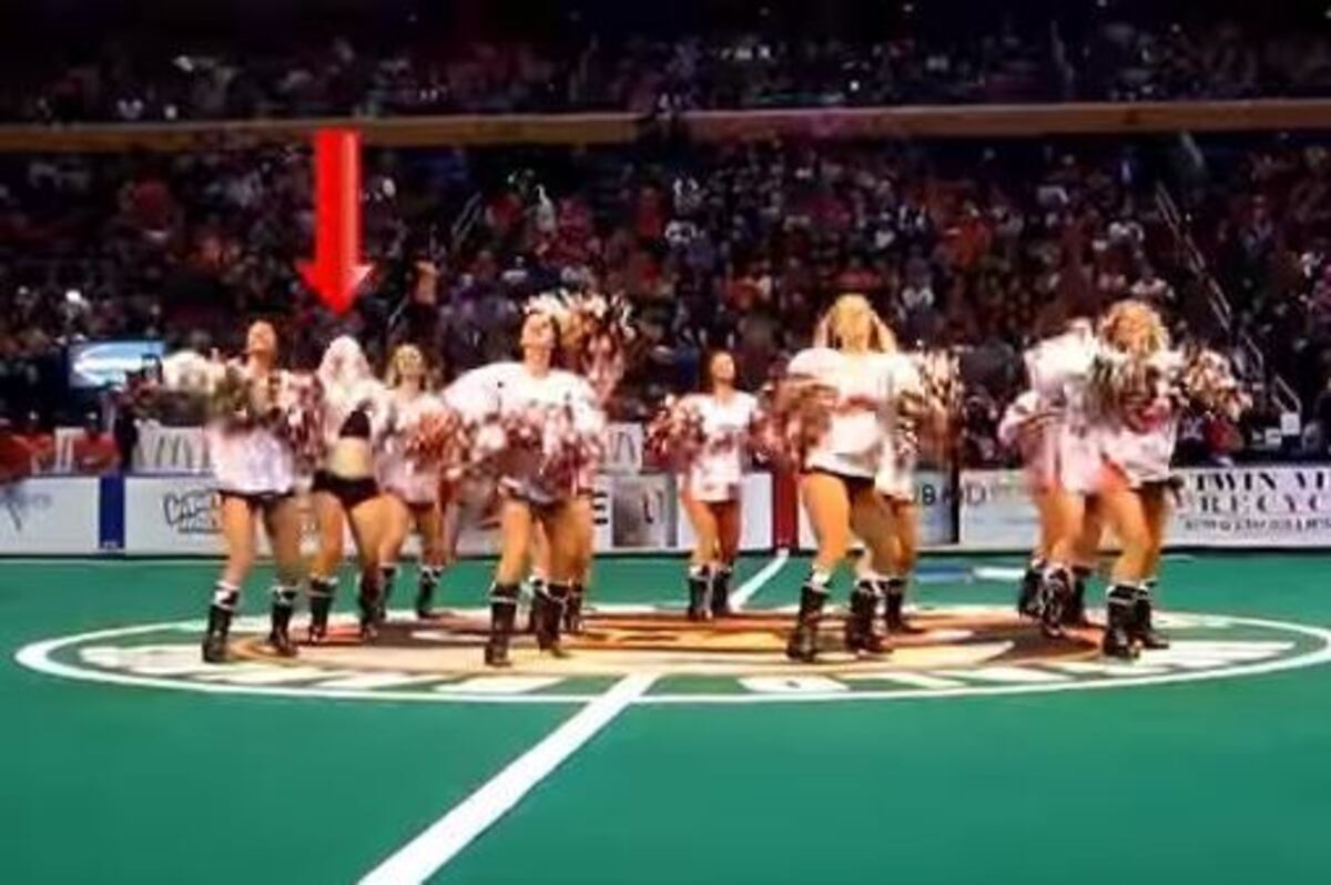 Cheerleader Continues On With Routine Despite Wardrobe Malfunction