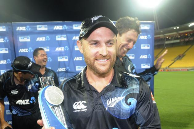 New Zealand's captain Brendon McCullum holds the trophy as his teammates celebrate after their series' victory over India during the fifth one day International cricket match at Westpac Stadium in Wellington, New Zealand, Friday, Jan. 31, 2014. (AP Photo/SNPA, Ross Setford) NEW ZEALAND OUT