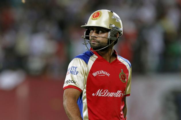 Virat Kohli of Royal Challengers Bangalore reacts as he walks back to the pavilion after being dismissed during an Indian Premier League cricket match against King XI Punjab in Dharmsala, India, Tuesday, May 17, 2011. (AP Photo/Ashwini Bhatia)