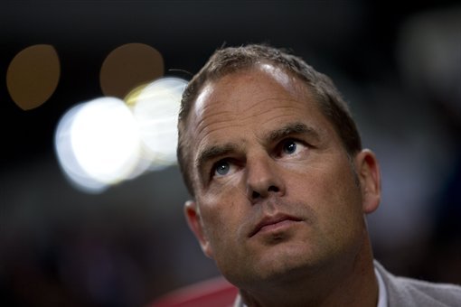 Ajax coach Frank de Boer watches his players at the start of the national soccer league game match against Twente at ArenA stadium in Amsterdam, Netherlands, Saturday Sept. 29, 2012. (AP Photo/Peter Dejong)