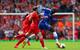 LIVERPOOL, ENGLAND - APRIL 27: Demba Ba of Chelsea breaks away from Mamadou Sakho and Joe Allen of Liverpool during the Barclays Premier League match between Liverpool and Chelsea at Anfield on April 27, 2014 in Liverpool, England. (Photo by Clive Brunskill/Getty Images)