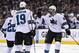 San Jose Sharks right wing Brent Burns, right, celebrates his goal with teammates defenseman Dan Boyle, left, and center Joe Thornton during the first period in Game 3 of an NHL hockey first-round playoff series , Tuesday, April 22, 2014, in Los Angeles. (AP Photo/Mark J. Terrill)