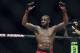 Apr 26, 2014; Baltimore, MD, USA; Jon Jones puts his arms in the air after the UFC light heavy weight championship fight against Glover Texeira at Baltimore Arena. Jones retained the light heavy height championship by defeating Teixeria. Mandatory Credit: Tommy Gilligan-USA TODAY Sports
