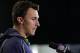 Texas A&M quarterback Johnny Manziel answers a question during a news conference at the NFL football scouting combine in Indianapolis, Friday, Feb. 21, 2014. (AP Photo/Michael Conroy)