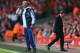 LIVERPOOL, ENGLAND - APRIL 27: Jose Mourinho manager of Chelsea gives his team instructions as Liverpool manager Brendan Rodgers walks away showing his dejectioin during the Barclays Premier League match between Liverpool and Chelsea at Anfield on April 27, 2014 in Liverpool, England. (Photo by Clive Brunskill/Getty Images)