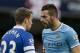 Manchester City's Alvaro Negredo, right, confronts Everton's Seamus Coleman during their English Premier League soccer match at the Etihad Stadium, Manchester, England, Saturday Oct. 5, 2013. (AP Photo/Jon Super)