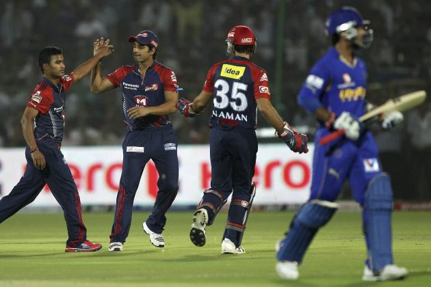 Delhi Daredevils Pawan Negi, left, celebrates the dismissal of Rajasthan Royals' Ajinkya Rahane during their Indian Premier League (IPL) match in Jaipur, India, Tuesday, May 1, 2012. (AP Photo) INDIA OUT