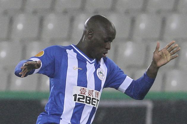 Wigan Athletic Marc-Antoine Fortune takes the ball, during the Europa League group stages in group D against Zulte-Waregem, at the Jan Breydel stadium in Bruges, Belgium, Thursday, Sept. 19, 2013. (AP Photo/Yves Logghe)