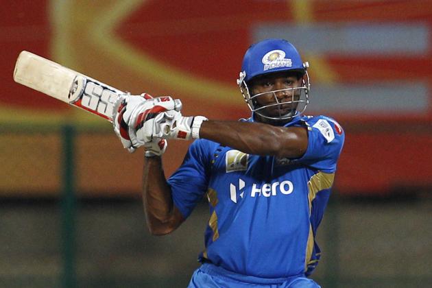 Mumbai Indians' batsman Kieron Pollard bats during the Champions League Twenty20 cricket match against Cape Cobras in Bangalore, India, Friday, Sept. 30, 2011. (AP Photo/Aijaz Rahi)