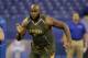 Virginia offensive lineman Morgan Moses runs a drill at the NFL football scouting combine in Indianapolis, Saturday, Feb. 22, 2014. (AP Photo/Michael Conroy)