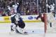 The puck bounces out of the net after Colorado Avalanche goalie Semyon Varlamov, second from left, of Russia lets the winning goal slip past off the stick of Minnesota Wild right wing Nino Niederreiter (22) of Switzerland in the overtime period during Game 7 of an NHL hockey first-round playoff series on Wednesday, April 30, 2014, in Denver. Minnesota won 5-4 to win the series. (AP Photo/Jack Dempsey)