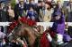 Victor Espinoza celebrates after riding California Chrome to victory in the 140th running of the Kentucky Derby horse race at Churchill Downs Saturday, May 3, 2014, in Louisville, Ky. (AP Photo/David Goldman)