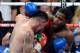 LAS VEGAS, NV - MAY 03: (R-L) Adrien Broner throws a right at Carlos Molina during their super lightweight bout at the MGM Grand Garden Arena on May 3, 2014 in Las Vegas, Nevada. (Photo by Ethan Miller/Getty Images)