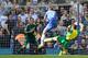 Chelsea's Branislav Ivanovic, center, defends as Norwich's Bradley Johnson misses the ball watched by Chelsea's goalkeeper Mark Schwarzer during their English Premier League soccer match at Stamford Bridge stadium in London Sunday May 4, 2014. (AP Photo/Alastair Grant)