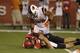 Utah quarterback Travis Wilson, below, is sacked by Oregon State defensive end Scott Crichton (95) in the first quarter during an NCAA college football game Saturday, Sept. 14, 2013, in Salt Lake City. (AP Photo/Rick Bowmer)