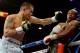 LAS VEGAS, NV - MAY 03: (L-R) Marcos Maidana throws a left at Floyd Mayweather Jr. during their WBC/WBA welterweight unification fight at the MGM Grand Garden Arena on May 3, 2014 in Las Vegas, Nevada. (Photo by Harry How/Getty Images)