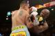 LAS VEGAS, NV - MAY 03: (L-R) Marcos Maidana and Floyd Mayweather Jr. exchange blows during their WBC/WBA welterweight unification fight at the MGM Grand Garden Arena on May 3, 2014 in Las Vegas, Nevada. Mayweather took Maidana's title with a majority-decision victory. (Photo by Harry How/Getty Images)