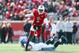 LOUISVILLE, KY - NOVEMBER 23: Teddy Bridgewater #5 of the Louisville Cardinals avoids the tackle of Chase Rome #47 of the Memphis Tigers at Papa John's Cardinal Stadium on November 23, 2013 in Louisville, Kentucky. (Photo by Andy Lyons/Getty Images)