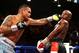 May 3, 2014; Las Vegas, NV, USA; Marcos Maidana (left) hits Floyd Mayweather Jr during their fight at MGM Grand. Mandatory Credit: Mark J. Rebilas-USA TODAY Sports