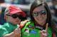 Danica Patrick holds Kevin Harvick's son Keelan before the NASCAR Aaron's 499 Sprint Cup series auto race at Talladega Superspeedway, Sunday, May 4, 2014, in Talladega, Ala. (AP Photo/Rainier Ehrhardt)