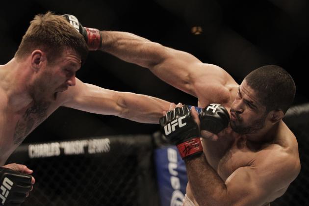 Dan Miller of the U.S, left, and Brazil's Rousimar Palhares exchange punches during their middleweight mixed martial arts bout at the Ultimate Fighting Championship (UFC) 134 in Rio de Janeiro, Brazil, Saturday Aug. 27, 2011. (AP Photo/Felipe Dana)