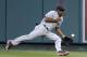 Cleveland Indians center fielder Michael Bourn can't get a glove on a triple by Los Angeles Angels' Mike Trout during the first inning of a baseball game in Anaheim, Calif., Monday, April 28, 2014. (AP Photo/Chris Carlson)