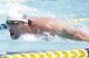 Michael Phelps competes in the 100-meter butterfly during the Arena Grand Prix, Thursday, April 24, 2014, in Mesa, Ariz. It is Phelps' first competitive event after a nearly two-year retirement. (AP Photo/Matt York)