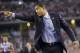 Connecticut head coach Kevin Ollie directs action against Kentucky during the first half of the NCAA Final Four tournament college basketball championship game Monday, April 7, 2014, in Arlington, Texas. (AP Photo/Eric Gay)