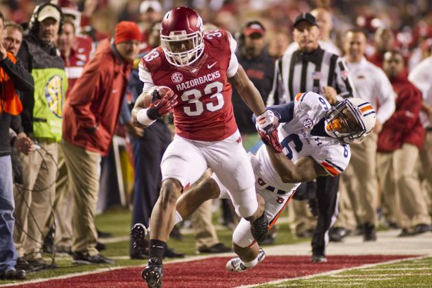 Arkansas running safety Korliss Marshall (33) is pursued by Auburn defensive back Jonathon Mincy (6) during an NCAA college football game in Fayetteville, Ark., Saturday, Nov. 2, 2013. Auburn defeated Arkansas 35-17. (AP Photo/Beth Hall)
