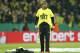 Dortmund head coach Juergen Klopp smiles as he puts on a T-Shirt with the words 'Final', after winning the German soccer cup (DFB Pokal) semifinal match between BvB Borussia Dortmund and VfL Wolfsburg Tuesday, April 15, 2014 in Dortmund, Germany. (AP Photo/Frank Augstein)