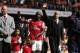 Arsenal's manager Arsene Wenger, center right, and Bacary Sagna, center left, wave to the supporters as the team parade around the stadium in their last home match of the season, after their English Premier League soccer match against West Bromwich Albion at Emirates Stadium in London, Sunday, May 4, 2014. (AP Photo/Sang Tan)