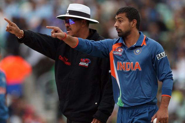 LONDON, ENGLAND - JUNE 03: Umpire Billy Doctrove and Praveen Kumar of India point to the crowd during the Twenty20 warm up match between India and Pakistan at The Brit Oval on June 3, 2009 in London, England. (Photo by Hamish Blair/Getty Images)