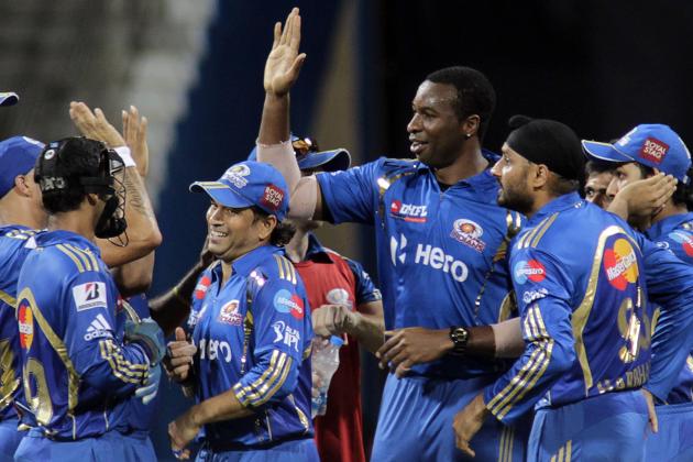Mumbai Indians’ Kieron Pollard, center right, Sachin Tendulkar, center left, and Harbhajan Singh, second right, celebrate the dismissal of Kolkata Knight Riders’ Gautam Gambhir during an Indian Premier League (IPL) cricket match in Mumbai, India, Wednesday, May 16, 2012. (AP Photo/Rajanish Kakade)