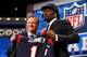 NEW YORK, NY - MAY 08: Jadeveon Clowney of the South Carolina Gamecocks stands on stage with NFL Commissioner Roger Goodell after he was picked #1 overall by the Houston Texansduring the first round of the 2014 NFL Draft at Radio City Music Hall on May 8, 2014 in New York City. (Photo by Elsa/Getty Images)