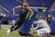 Louisville defensive lineman Marcus Smith runs a drill at the NFL football scouting combine in Indianapolis, Monday, Feb. 24, 2014. (AP Photo/Michael Conroy)
