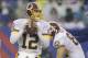 In the rain, Washington Redskins quarterback Kirk Cousins (12) looks to pass during the first half of an NFL football game against the New York Giants, Sunday, Dec. 29, 2013, in East Rutherford, N.J. (AP Photo/Julio Cortez)
