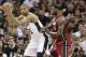 San Antonio Spurs' Tim Duncan is defended by Miami Heat's LeBron James, right, during the second half at Game 3 of the NBA Finals basketball series, Tuesday, June 11, 2013, in San Antonio. (AP Photo/Eric Gay)