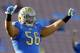 UCLA guard Xavier Su'a-Filo (56) warms up on the field prior to their NCCA college football game against Colorado Saturday, Nov. 2, 2013, in Pasadena, Calif. (AP Photo/Alex Gallardo)
