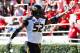 ATHENS, GA - OCTOBER 12: Michael Sam #52 of the Missouri Tigers recovers a fumble for a touchdown against the Georgia Bulldogs at Sanford Stadium on October 12, 2013 in Athens, Georgia. (Photo by Kevin C. Cox/Getty Images)