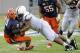 Syracuse quarterback Drew Allen (8) is sacked by Penn State defensive tackle DaQuan Jones during the fourth quarter of an NCAA college football game Saturday, Aug. 31, 2013, in East Rutherford, N.J. Penn State won 23-17. (AP Photo/Bill Kostroun)
