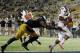 Oregon State running back Terron Ward (28) scores a touchdown past California linebacker Khairi Fortt (11) during the second half of an NCAA college football game in Berkeley, Calif., Saturday, Oct. 19, 2013. (AP Photo/Tony Avelar)