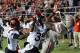LAS VEGAS, NV - NOVEMBER 30: Devante Davis #81 of the UNLV Rebels catches a 5-yard touchdown pass in the end zone against King Holder #35 and Nat Berhe #20 of the San Diego State Aztecs during their game at Sam Boyd Stadium on November 30, 2013 in Las Vegas, Nevada. (Photo by Ethan Miller/Getty Images)