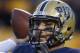 Pittsburgh quarterback Tom Savage (7) in action in an NCAA football game between Pittsburgh and Miami on Friday, Nov. 29, 2013 in Pittsburgh. (AP Photo/Keith Srakocic)