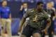 Tennessee State offensive lineman Kadeem Edwards runs a drill at the NFL football scouting combine in Indianapolis, Saturday, Feb. 22, 2014. (AP Photo/Michael Conroy)