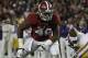 Alabama defensive lineman Ed Stinson (49) works against LSU during the first half of an NCAA college football game, Saturday, Nov. 9, 2013, in Tuscaloosa, Ala. (AP Photo/Butch Dill)