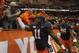 Syracuse’s Marquis Spruill, front, and Jay Bromley, back, celebrate with fans after defeating Boston College 34-31 in an NCAA college football game in Syracuse, N.Y., Saturday, Nov. 30, 2013. (AP Photo/Nick Lisi)