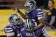 Kansas State wide receiver Tyler Lockett (16) celebrate his touchdown with teammates Tavon Rooks (73) and Cornelius Lucas (78) during the first half of the Buffalo Wild Wings Bowl NCAA college football game against Michigan, Saturday, Dec. 28, 2013, in Tempe, Ariz. (AP Photo/Matt York)