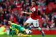 LONDON, ENGLAND - OCTOBER 19: Mesut Oezil of Arsenal is tackled by Wes Hoolahan of Norwich City during the Barclays Premier League match between Arsenal and Norwich City at Emirates Stadium on October 19, 2013 in London, England. (Photo by Paul Gilham/Getty Images)